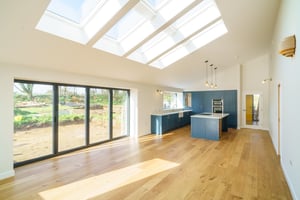 Internal image of the open plan living space of a new barn conversion