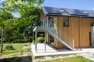 Timber cladded rear extension with balcony
