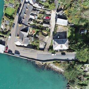 drone photograph of site and surrounding water