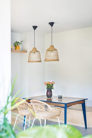 dining area with two chairs and table with blue legs