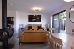 sitting area with mustard sofas
