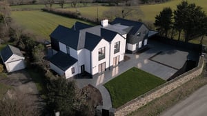elevated view of white rendered house