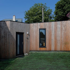 external view of one storey wooden clad garage conversion