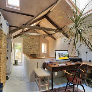 office space with exposed roof structure