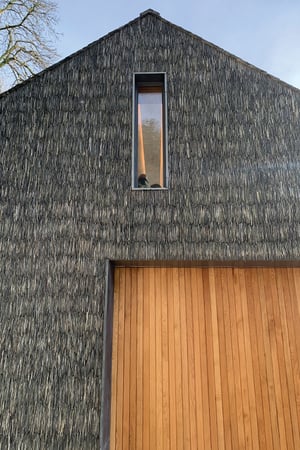 main entrance image of a boathouse with featured slate finishes