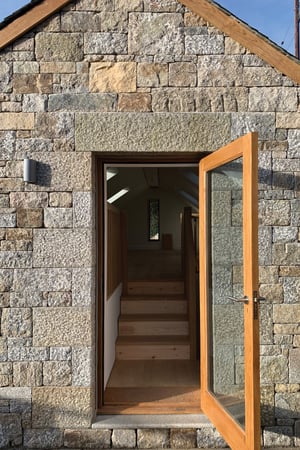 external-open-timber-doors-stone-entrance