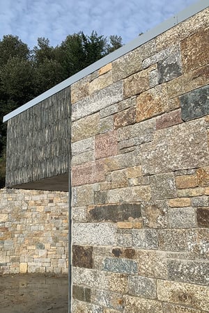 detail of where stone meets the overhanging slate finish