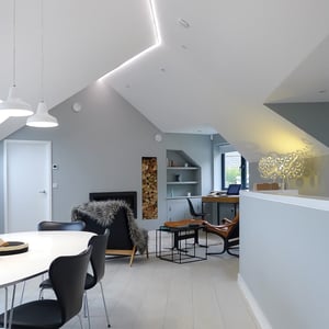 dining table with sitting area behind