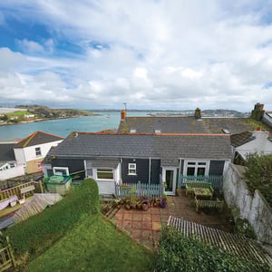 external birds eye view of garden with views out to Falmouth harbour
