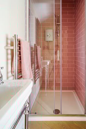 pink tiled shower room