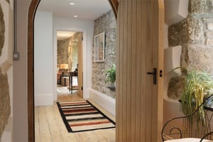 view through arched doorway towards living room