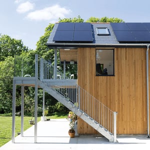 timber clad extension with industrial balcony