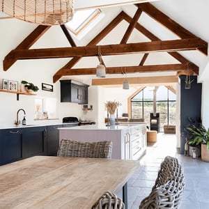 internal view of open plan kitchen living room with traditional open trussed rood