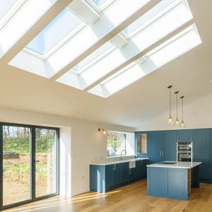 internal view of kitchen with large roof lights and lots of natural light