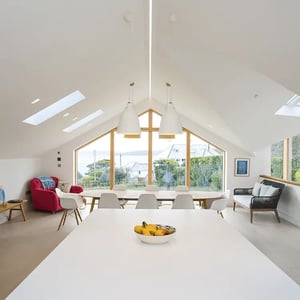 large gable windows with views towards the water and Pendenis castle